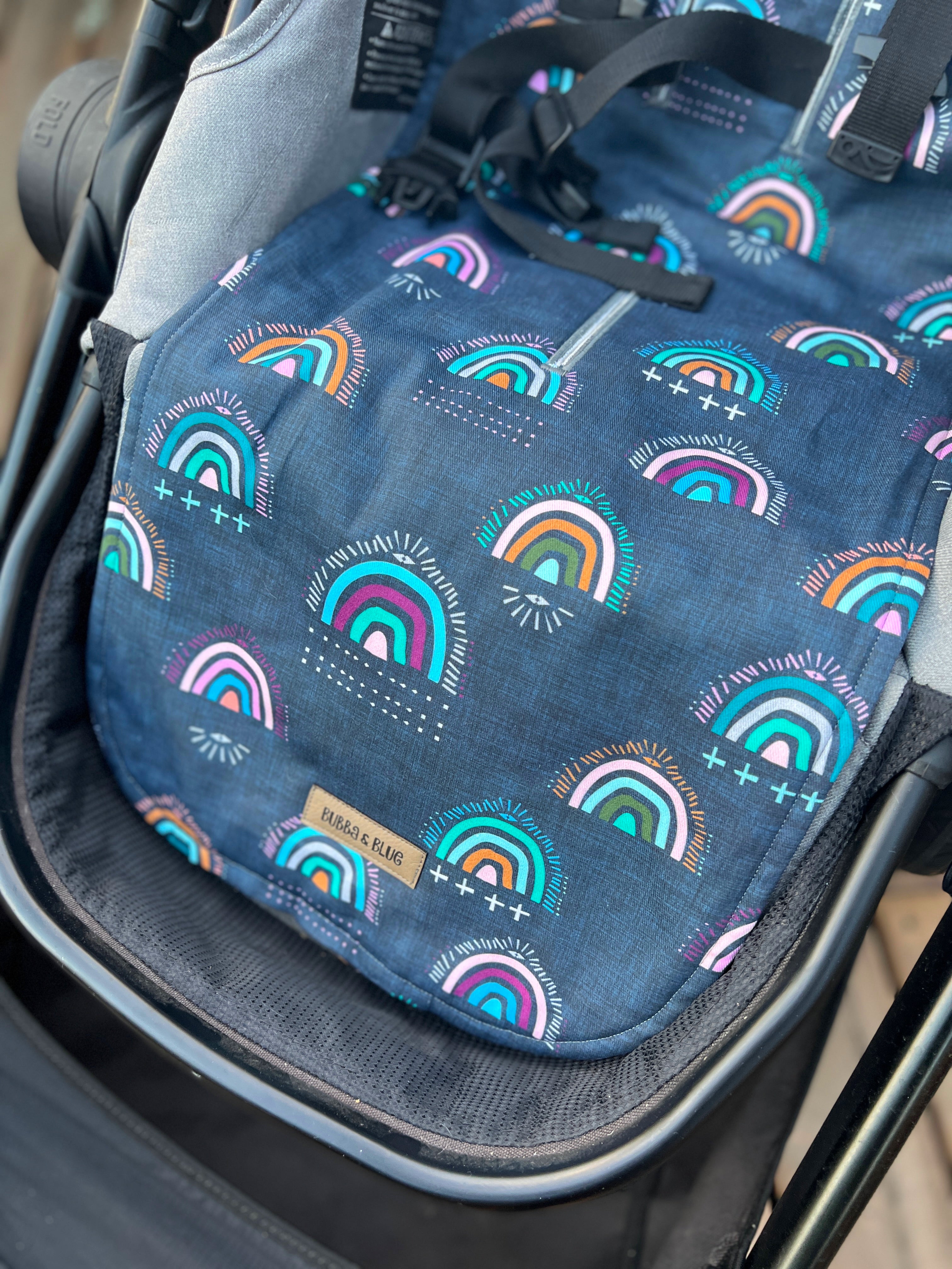 Universal fit stroller liner in navy rainbow