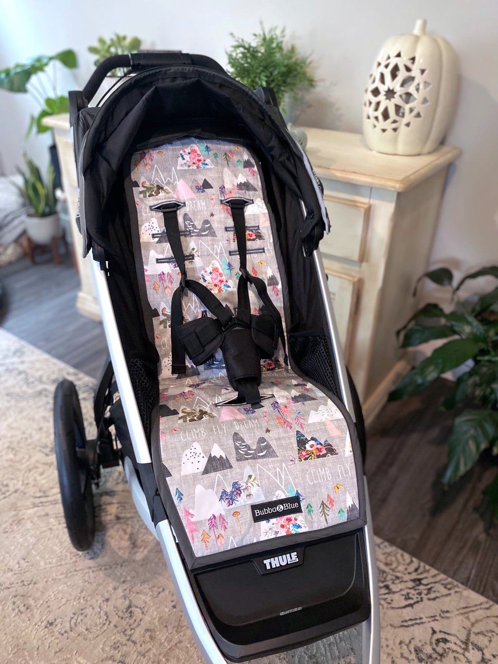 Stroller liner and foormuff set made to fit most strollers. Get a custom fit for a wide variety of strollers. These save your seat from wear and tear. This one is featured in the pint mountain print.