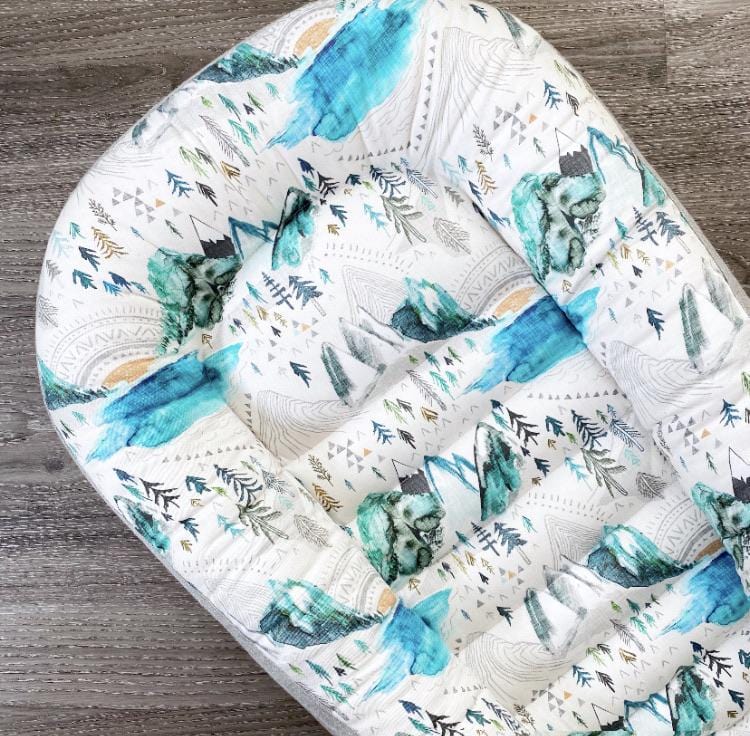 baby lounging nest for babies and toddlers in a mountain print 