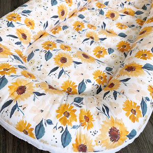 baby lounging nest in sunflower floral , a soft place to rest baby 